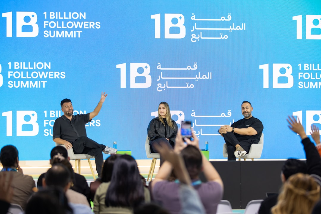 business consultation strategy - Speakers on stage at 1 billion followers summit event.