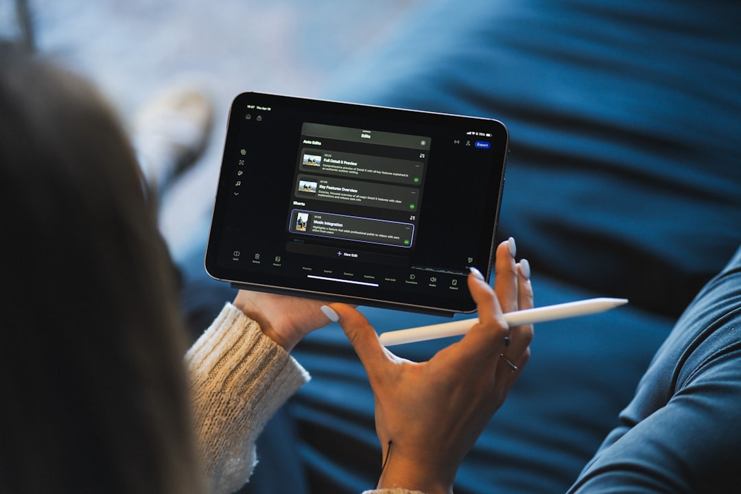 Software de desarrollo a medida para empresas en 2026: cuándo, cómo y cuánto cuesta 1 business workflow digital transformation - Person holding a tablet and stylus device.